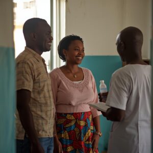 A couple talking to a nurse in a healthcare clinic in Benin 1
